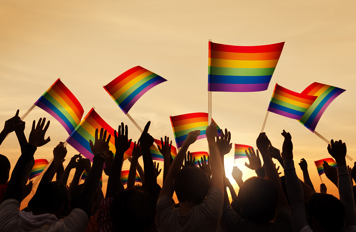 people waving rainbow flags