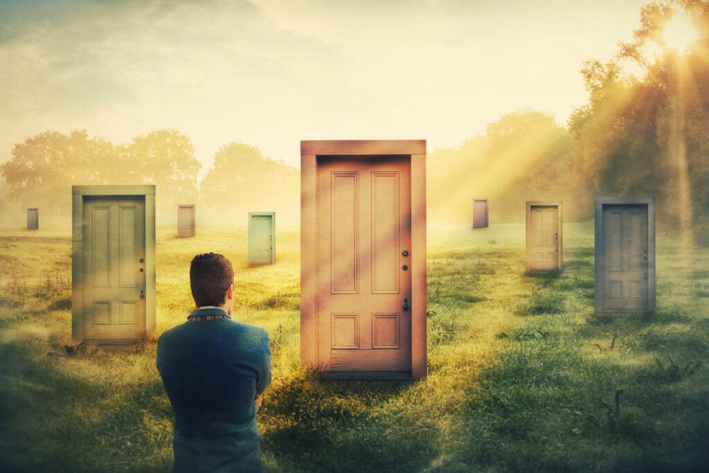 person looking at multiple doors