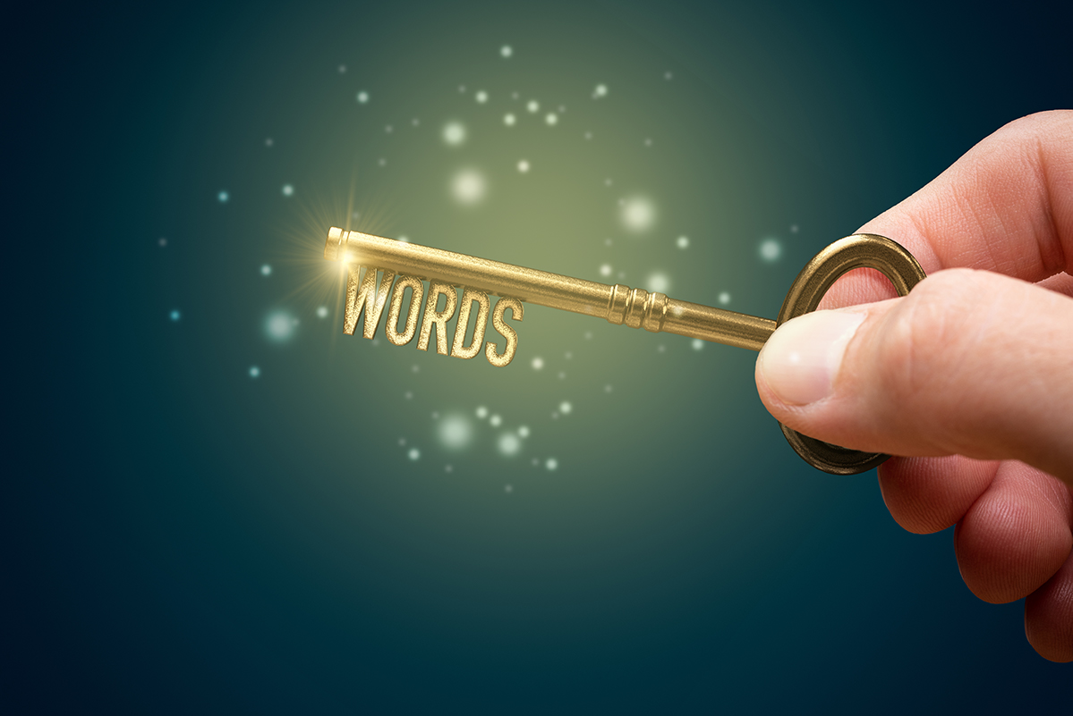 Someone holding an old fashioned key and "Words" is at the bottom