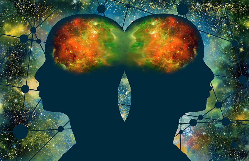 Silhouettes of two people connected in universe