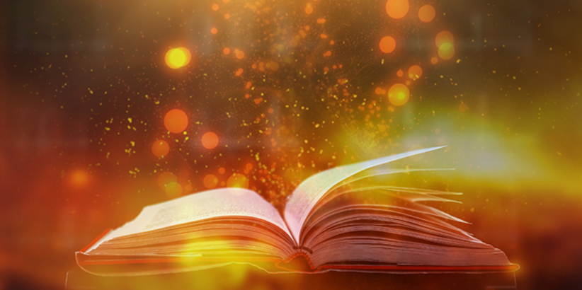 An open book with bubbles of color emerging from it.