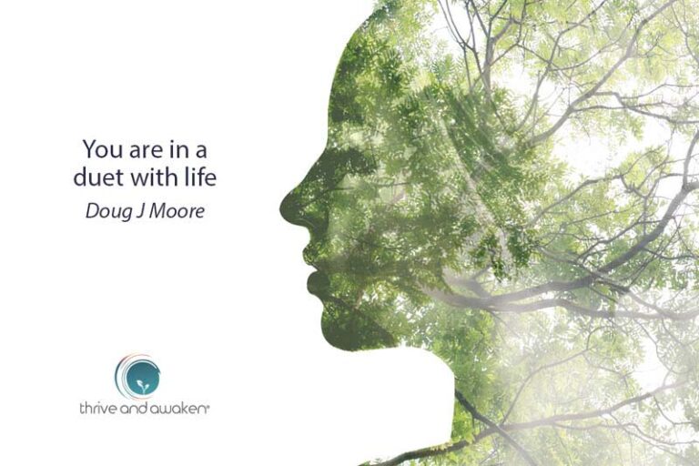 Silhouette of a person's head merged with a forest. Quote from Doug: You are in a duet with life