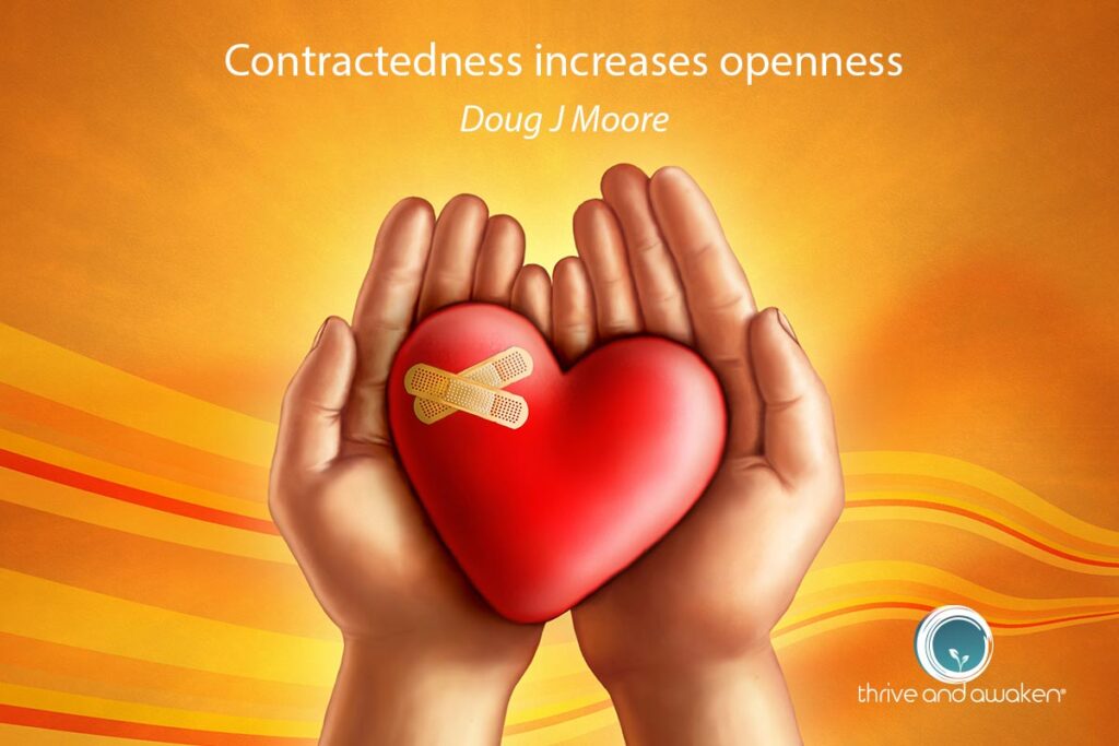 Cupped hands holding a heart with a bandaid on it.