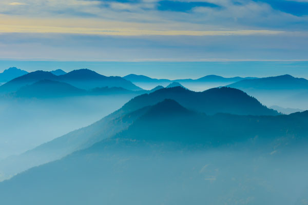 Bluish mountains with fog around